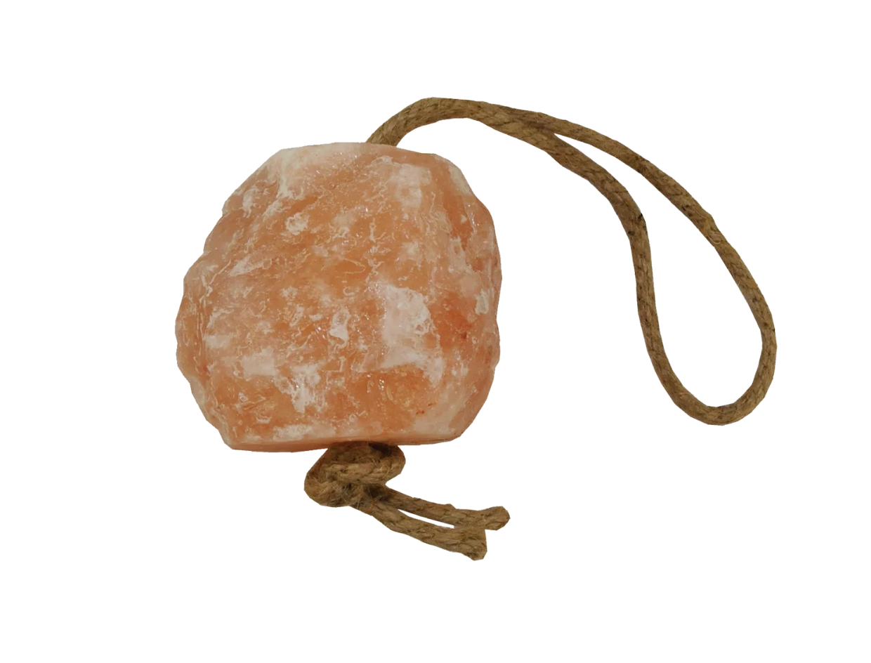 Himalayan salt rock with a rope on a white background